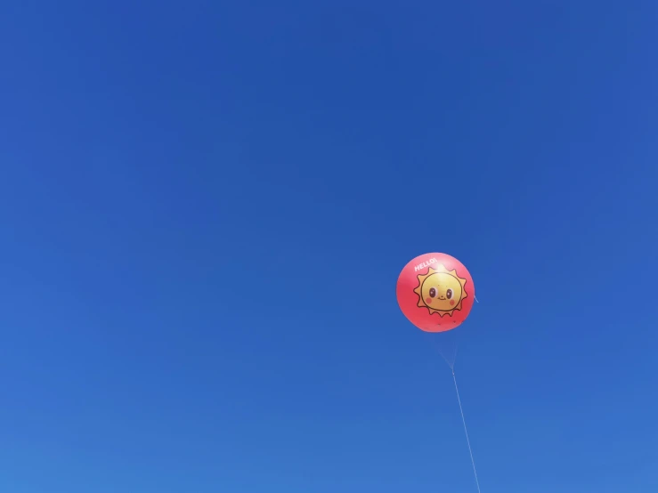 a very large balloon in the air flying