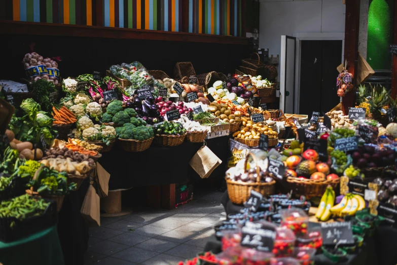 a market with lots of fresh produce in baskets