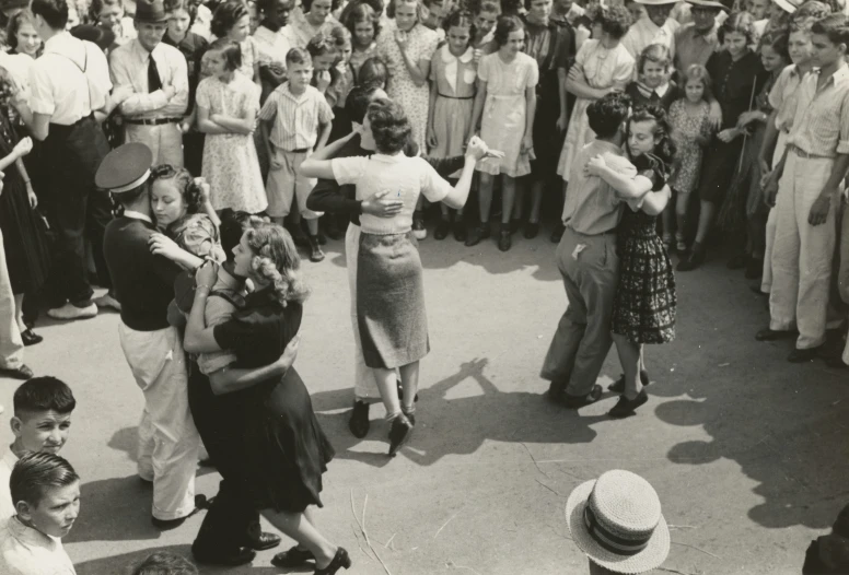 people dancing in the street in front of spectators