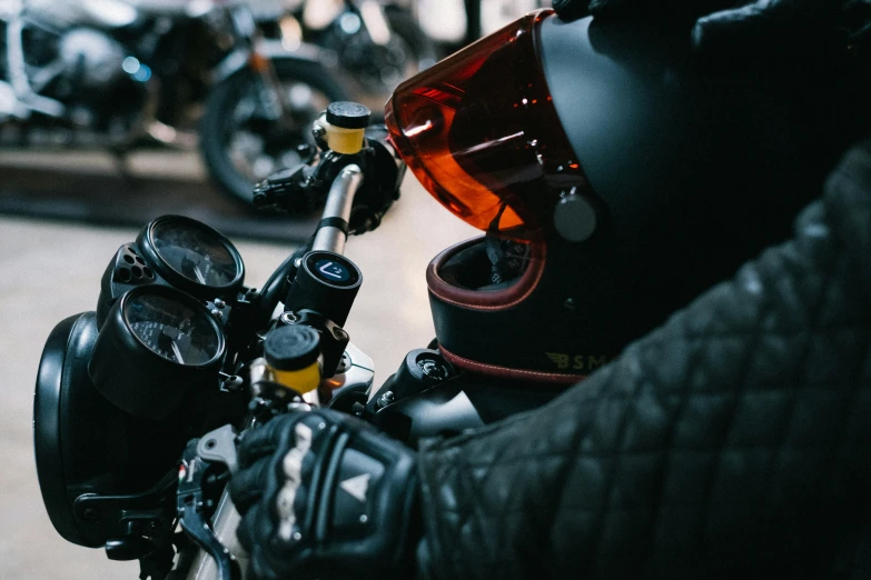 a helmet and gloves attached to an motor cycle