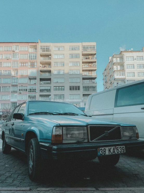 a large white van parked in front of some buildings