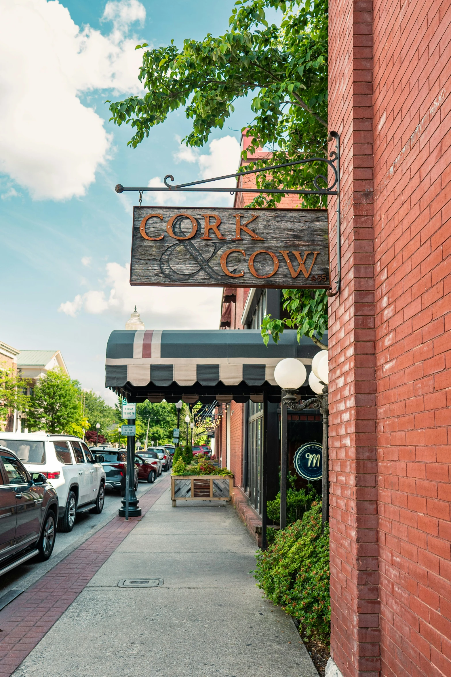 an outside view of the corner restaurant sign