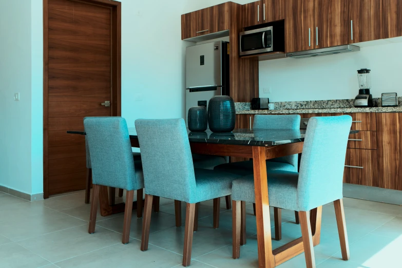 a kitchen and dining room with marble countertops