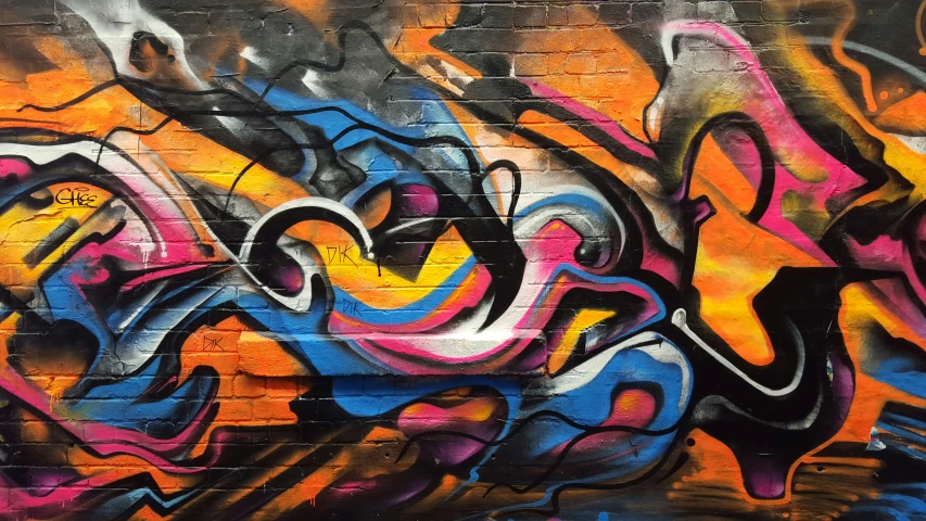 graffiti on a wall with colorful patterns and colors
