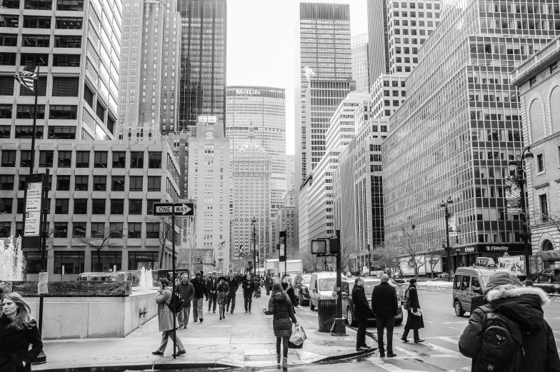 people cross a street in new york city