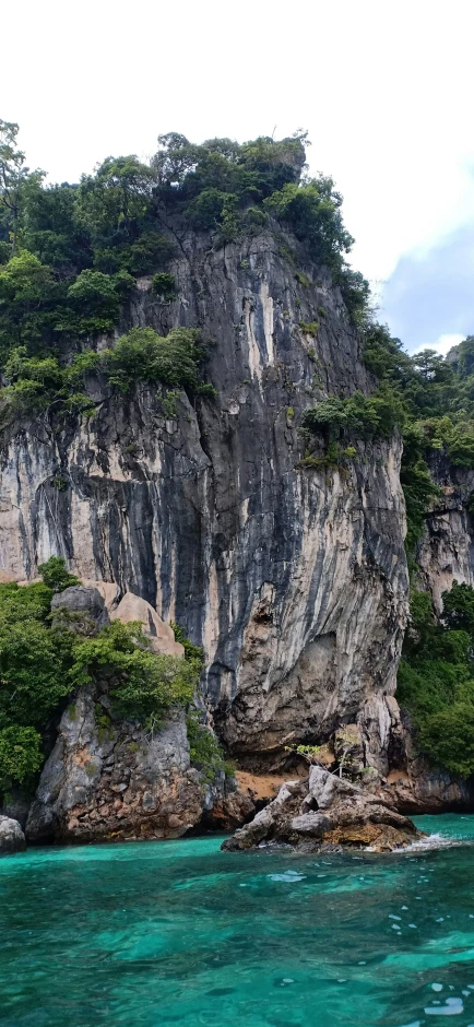 there is an island in the ocean near a cliff