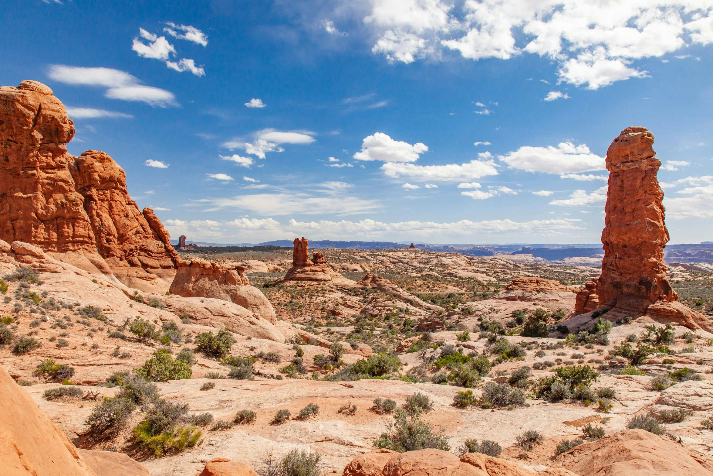 a vast area with many red rock formations