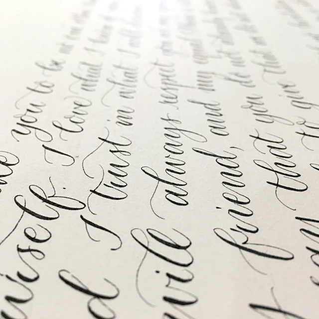 a bunch of very sharp cursive writing on paper