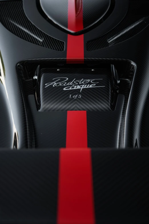 close up on the red and black carbon material of the unique carbon car