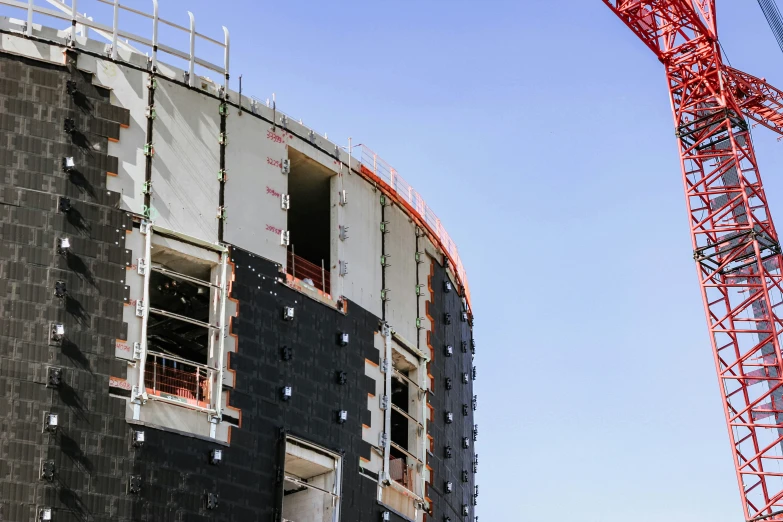 the crane is attached to the building under construction