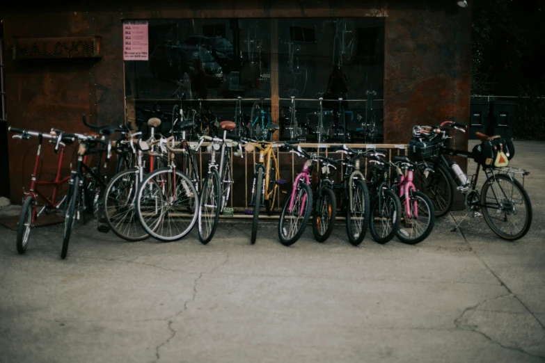 a group of bicycles parked next to a building