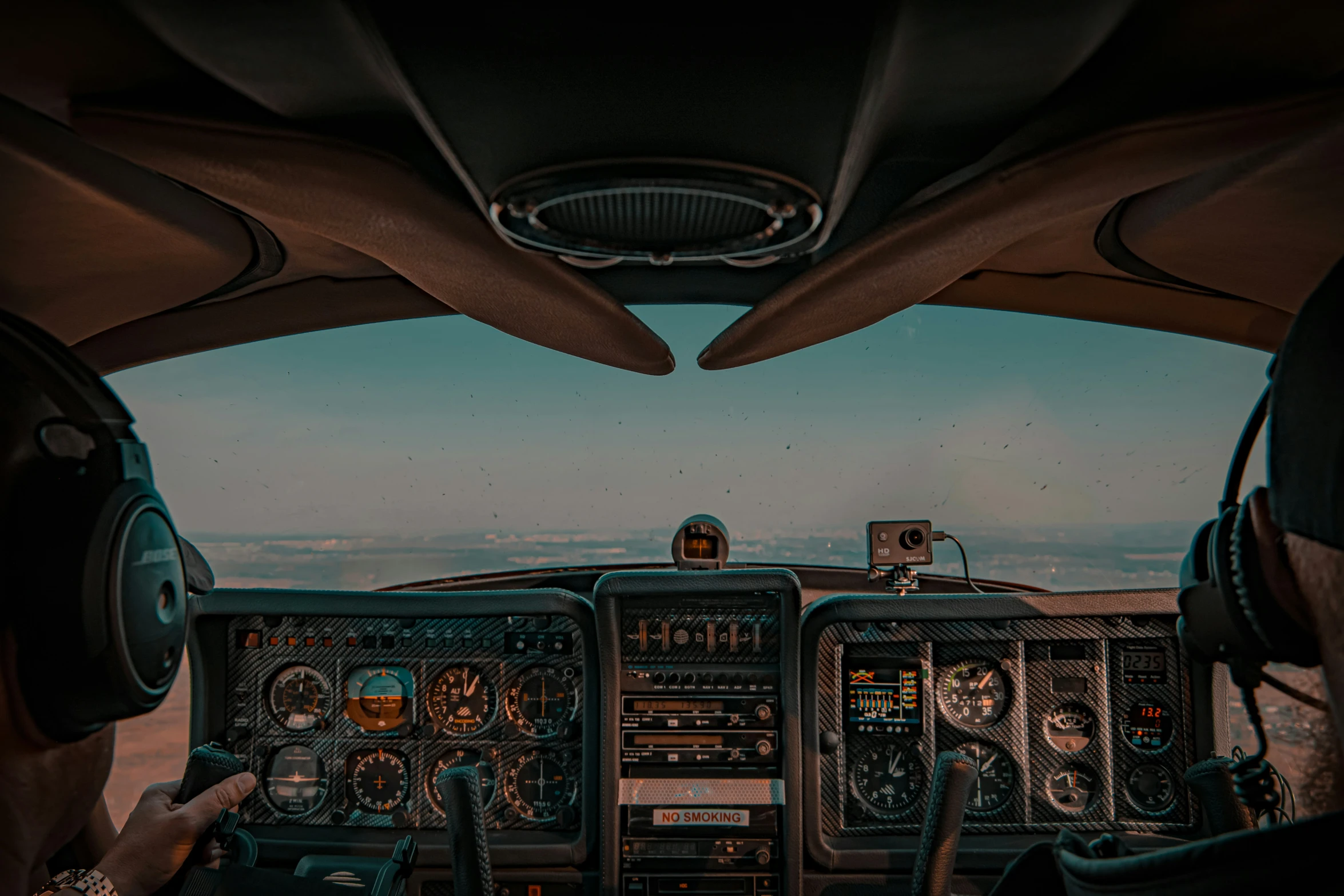 two pilots flying the cockpits of an airplane