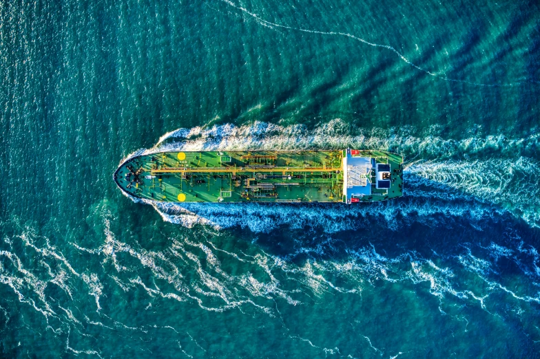 a large cargo boat traveling across a body of water