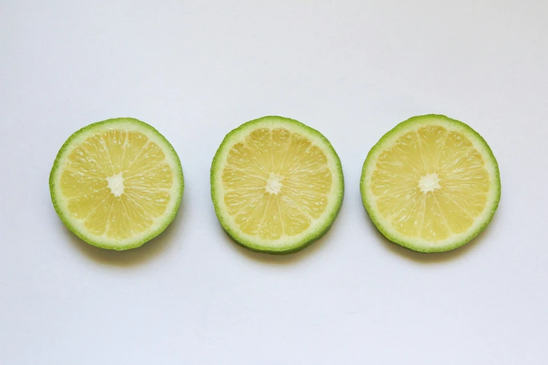 three pieces of fruit arranged in the shape of lemons