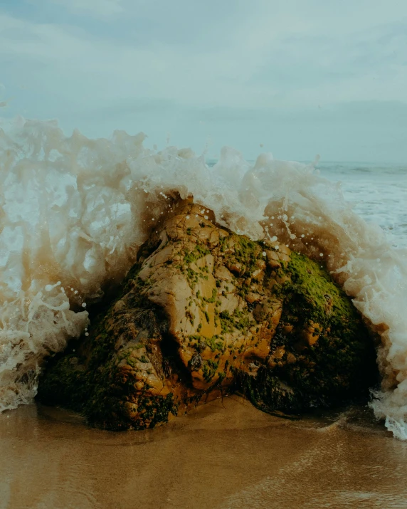 the ocean is crashing into the rocks