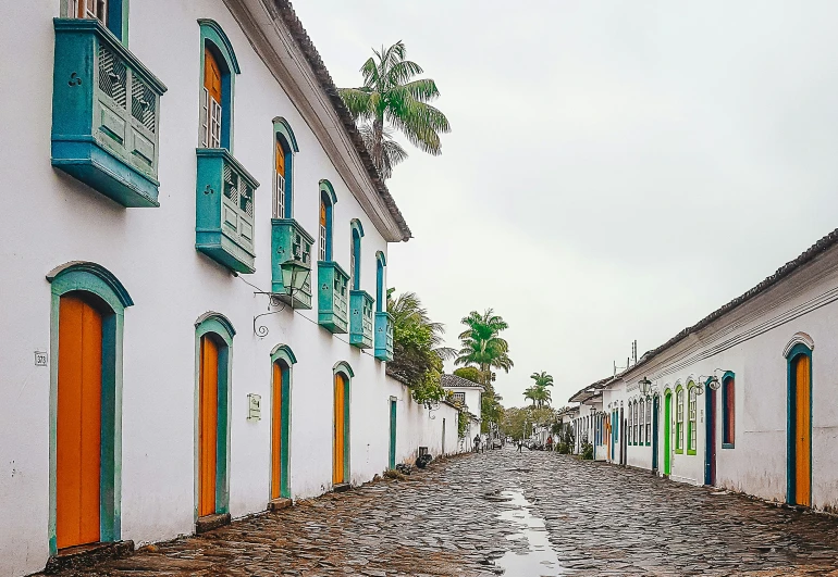 a colorful street lined with multi - colored windows