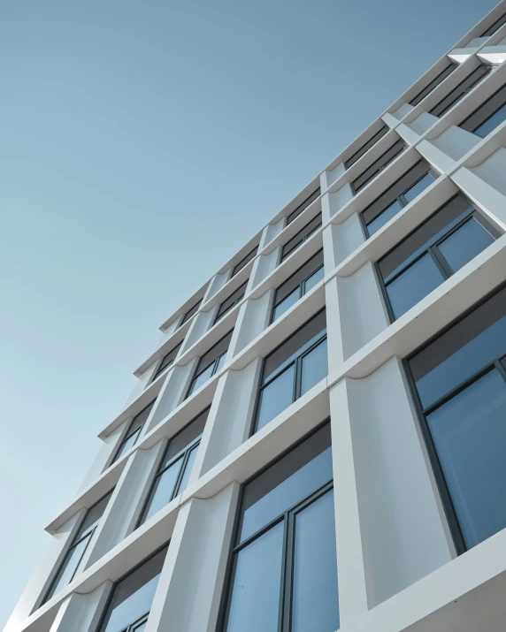 a close - up view of an apartment building, taken from below