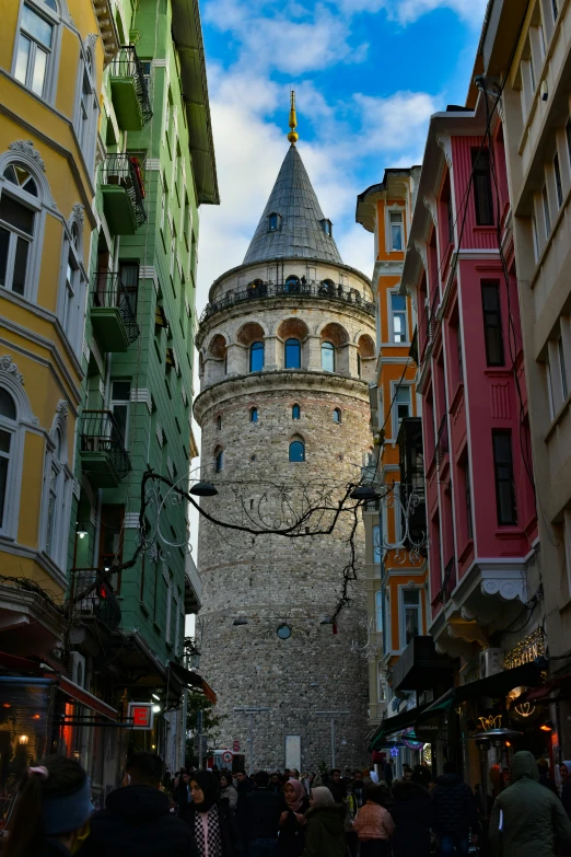 an old building sitting among other buildings in a city