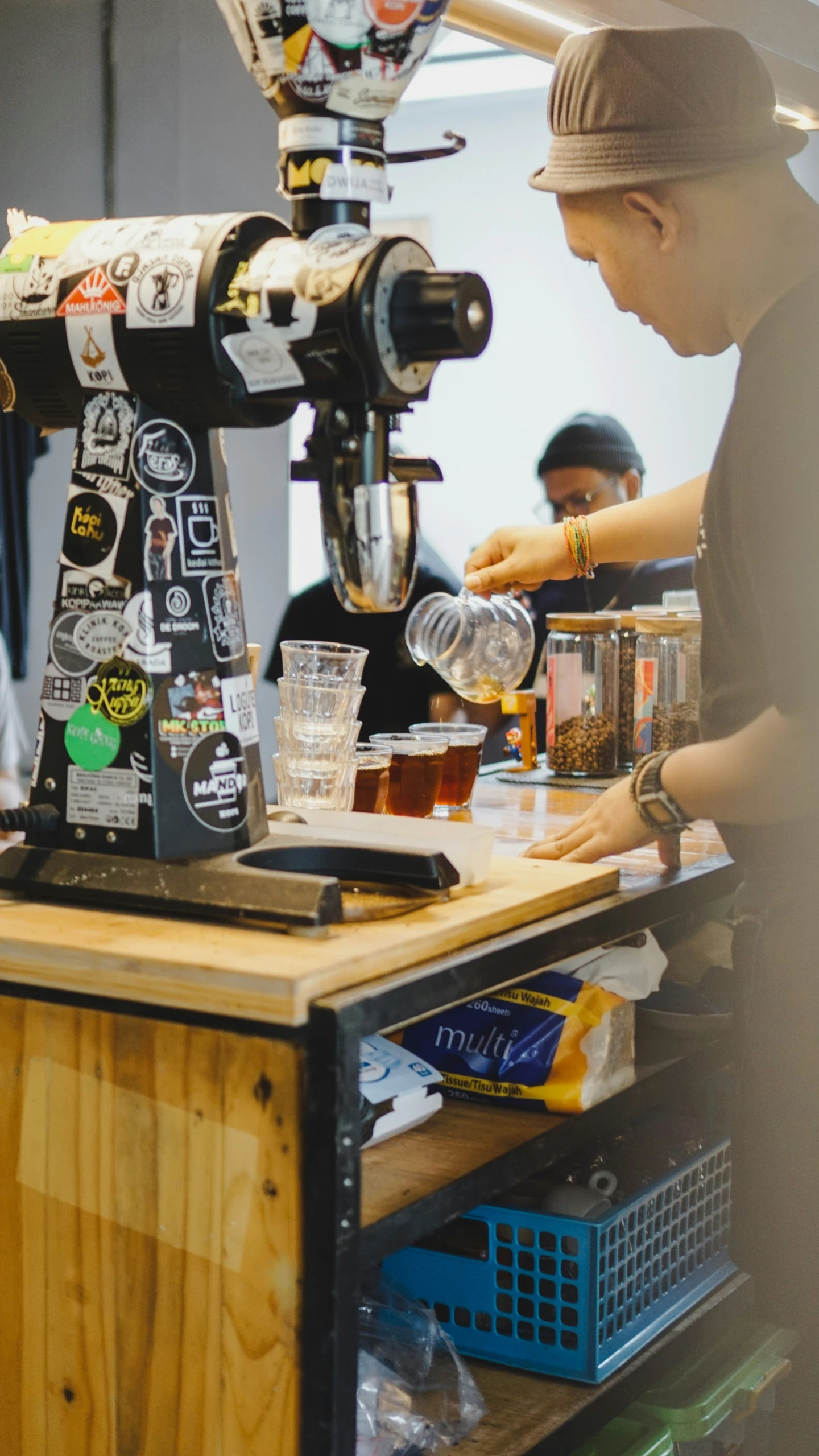 man pouring beer into his glass at a bar