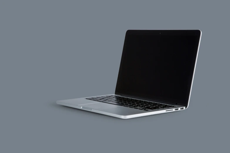 a lap top computer on a gray surface