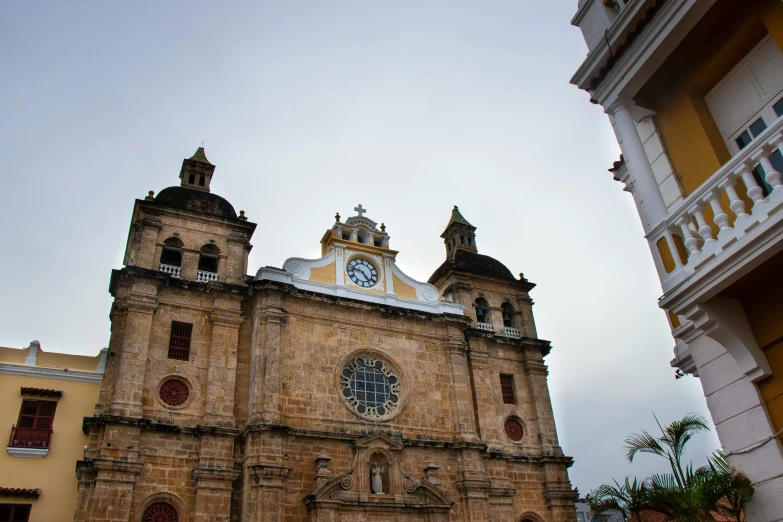 an old looking church in a large city