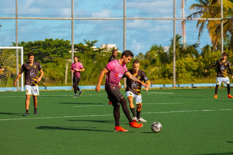 two soccer players fight for control of the ball during a match