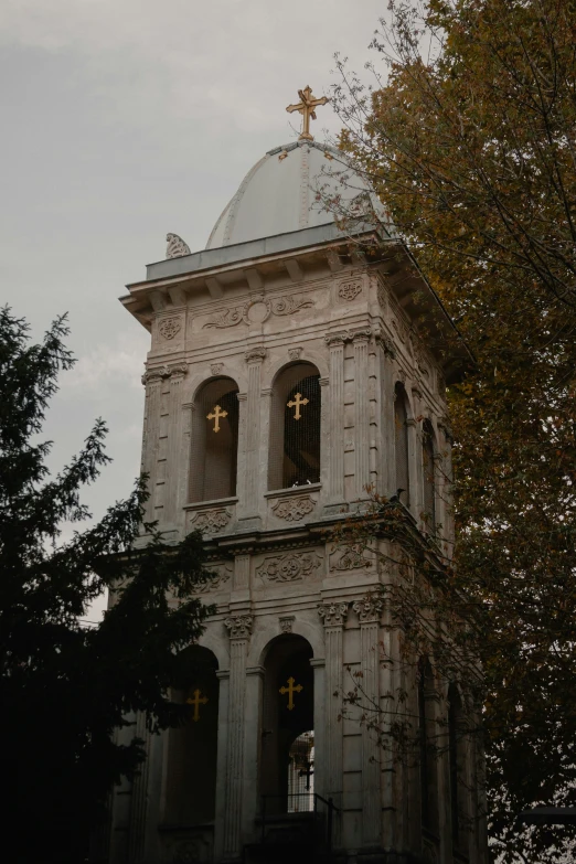 an old church has stained glass windows and a clock