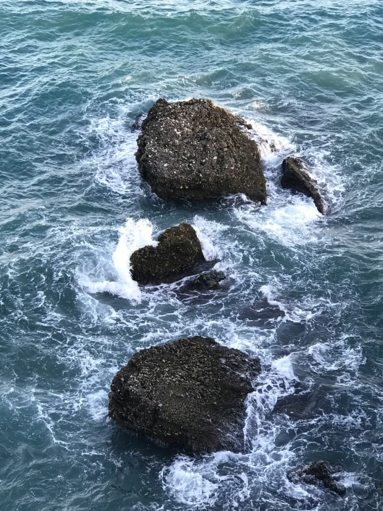 the rocks have been washed ashore as they break