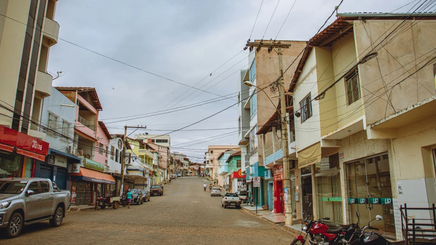 street view of buildings with power lines over head