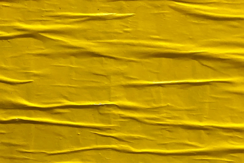 a yellow crinkle textured paper background