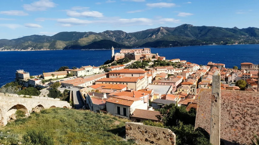 there are several large buildings near the water