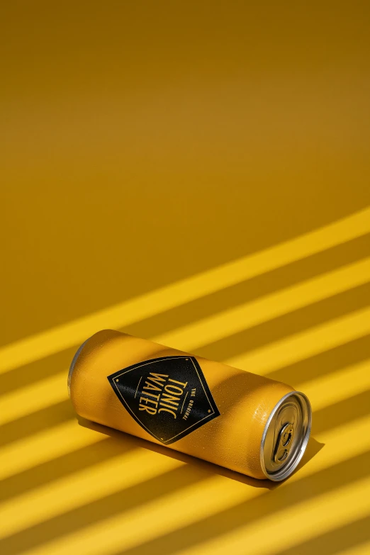 a drink on a yellow background with vertical stripes