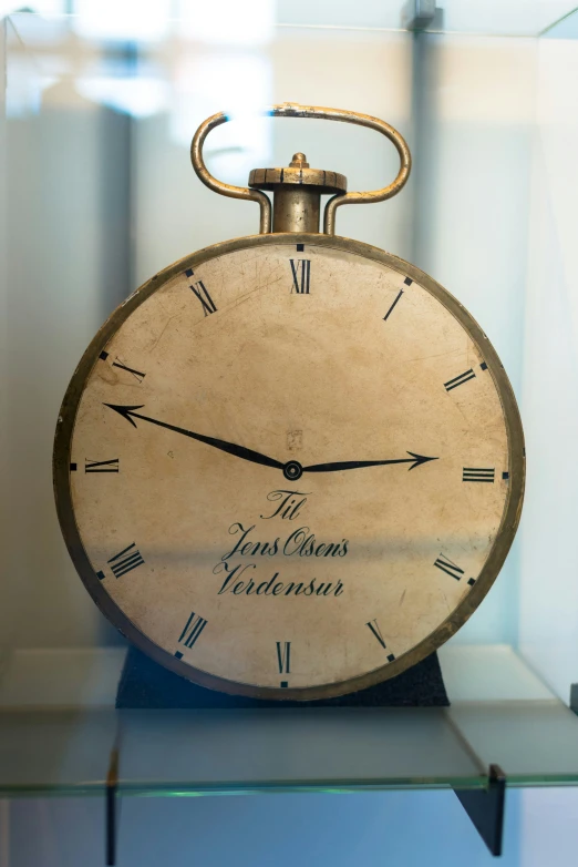 the old clock is on display in its case