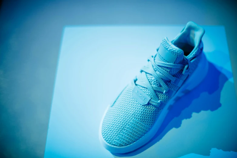 the blue glow of the adidas sneakers gives it soing that is uninstalled