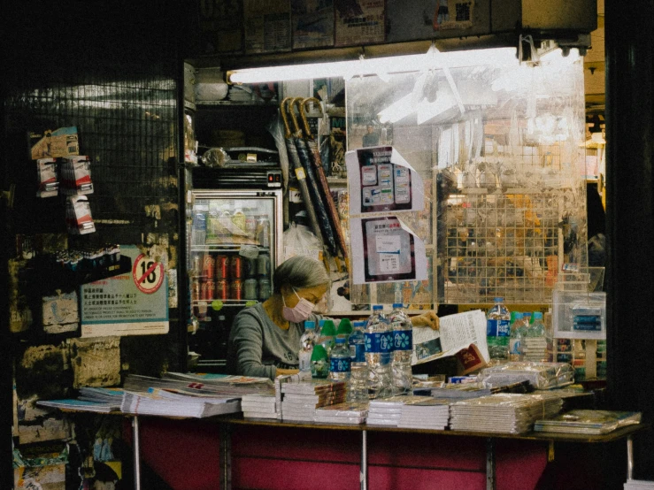 a woman at a counter in a liquor store