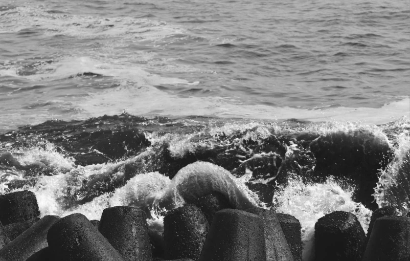 water is seen from the rocky shore