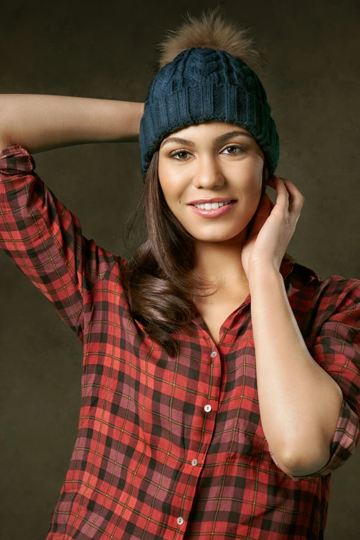 a woman with a ponytail in a red shirt