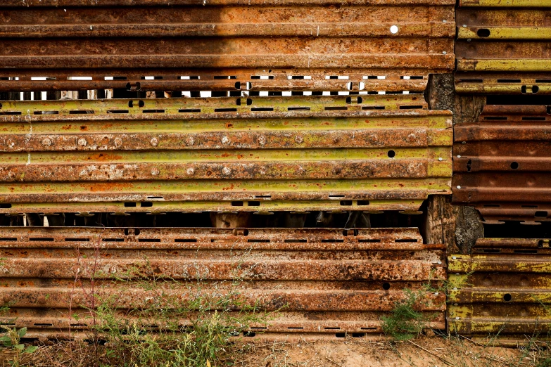 old rusted and stained building with siding