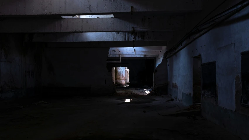 an old dark tunnel with a street light in the middle