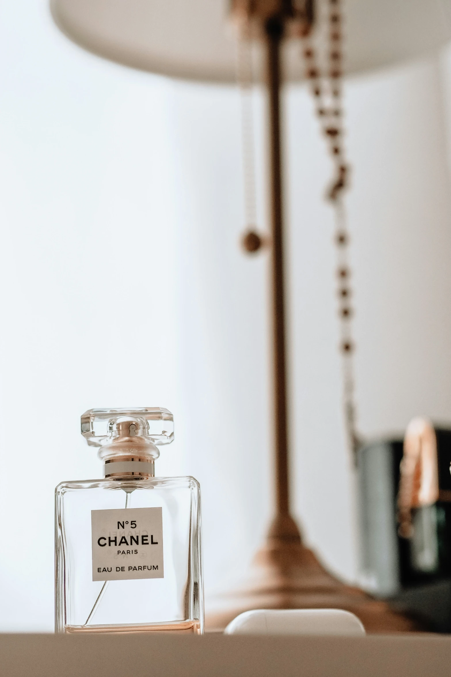 a chanel bottle sits on a table with the label