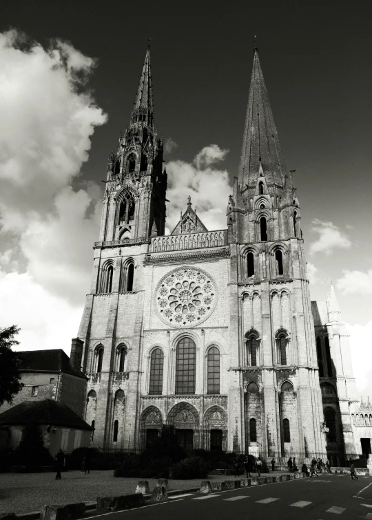 an image of a gothic cathedral that looks like it has a clock on the front