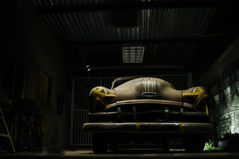 an automobile on display inside of a garage