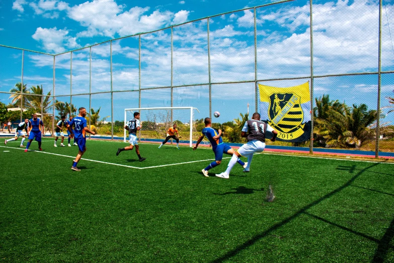 a man who is kicking a soccer ball around