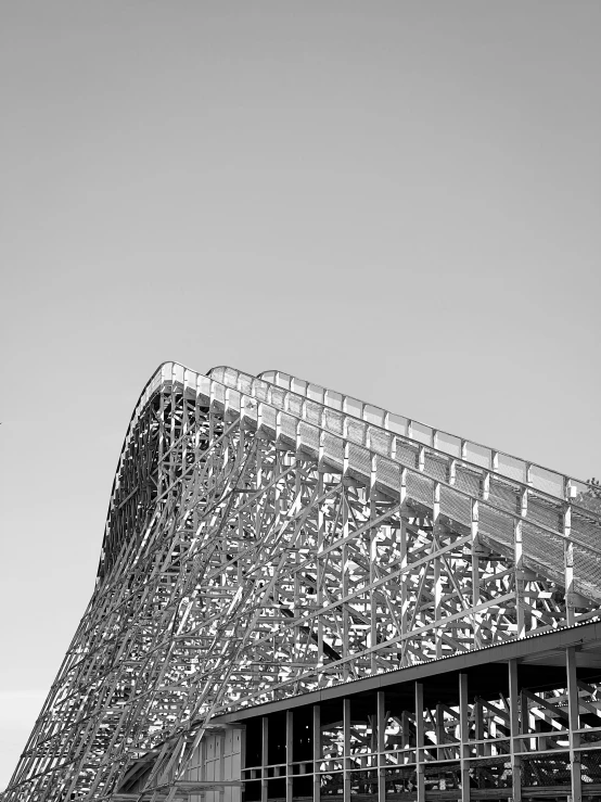 black and white pograph of a building with a curved metal railing