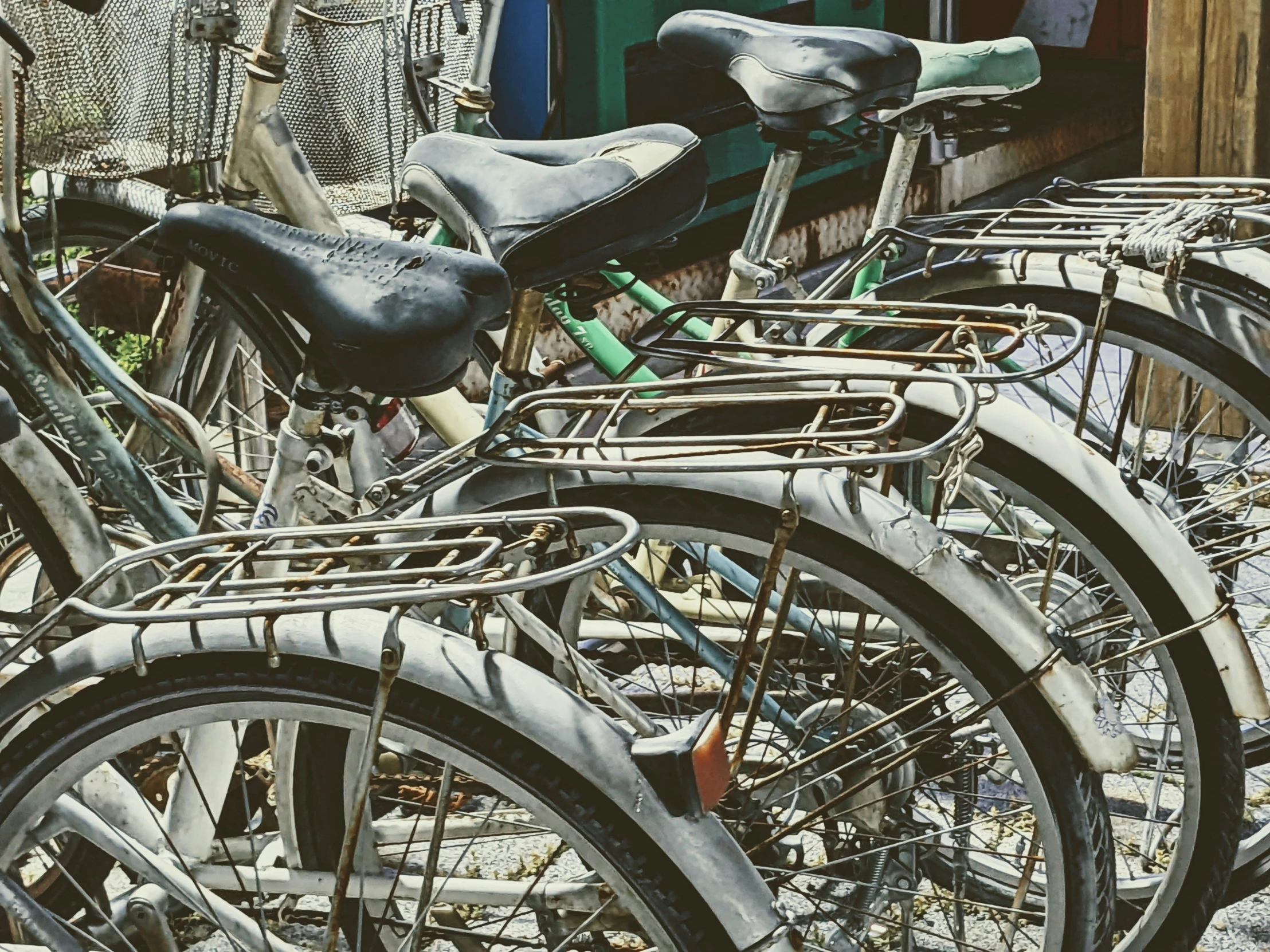 a bunch of bikes parked in a row