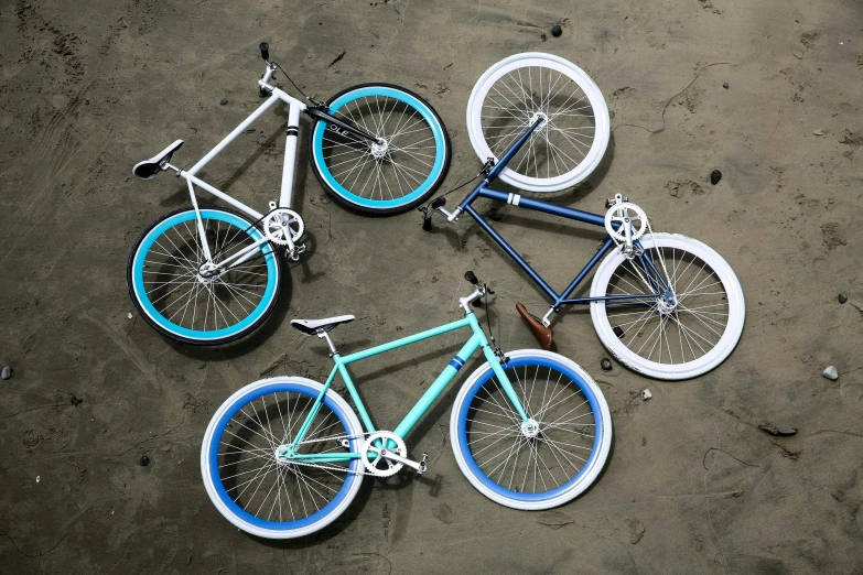a group of bicycles with wheels painted blue and white