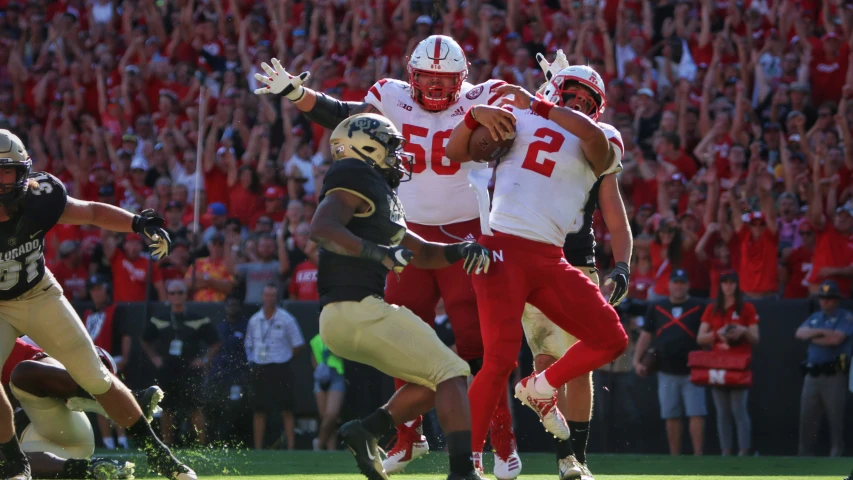 some football players are playing a game on a field