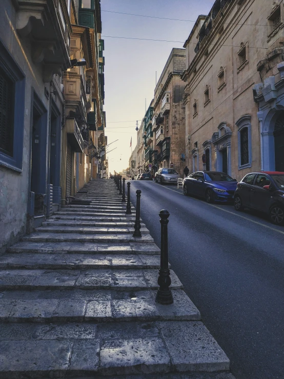 stairs going up the side of buildings in an old town