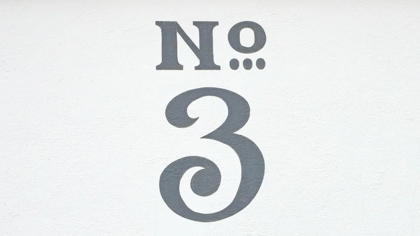 a white sign with two numbers on it