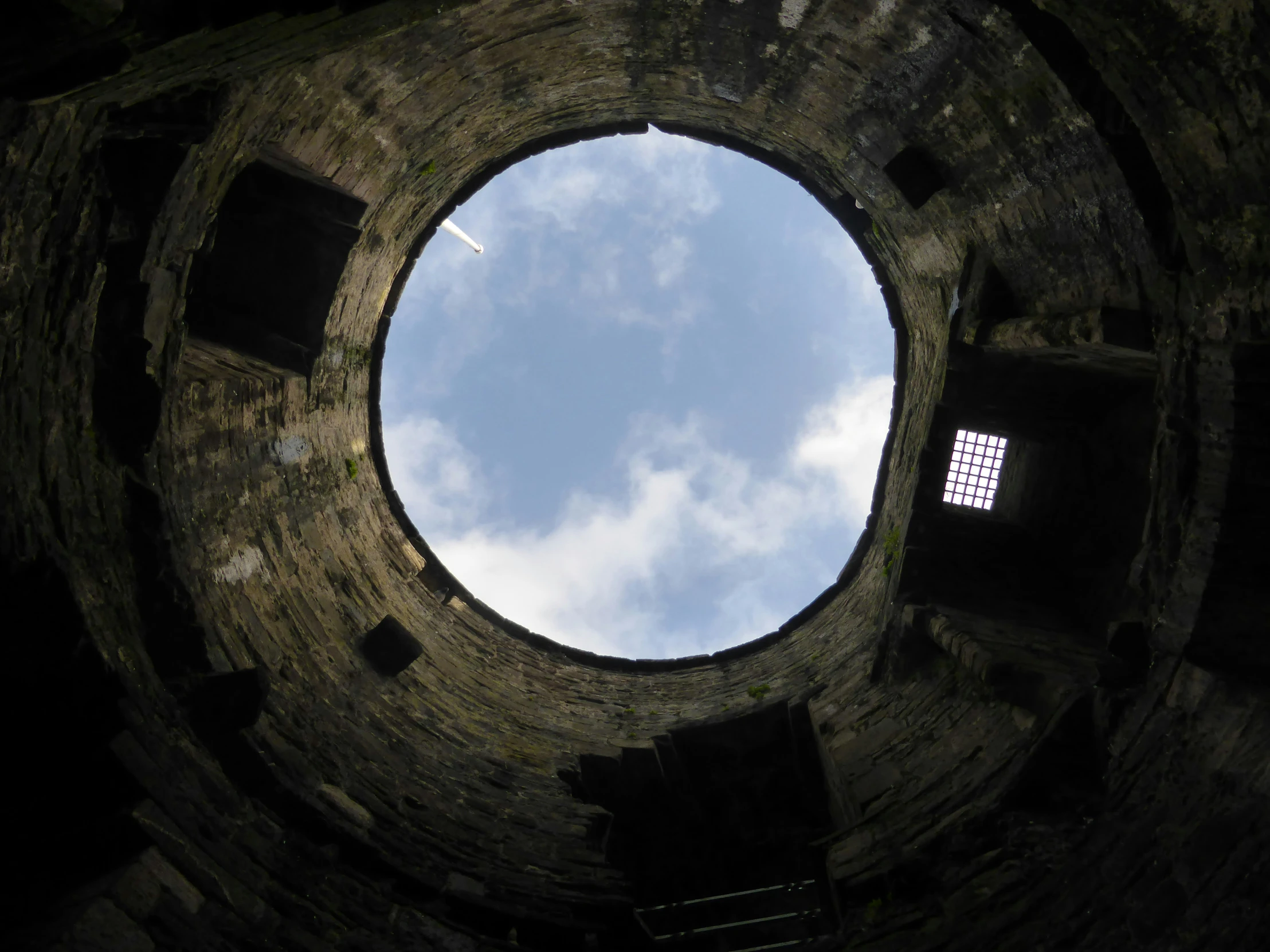 looking into an old and old brick building